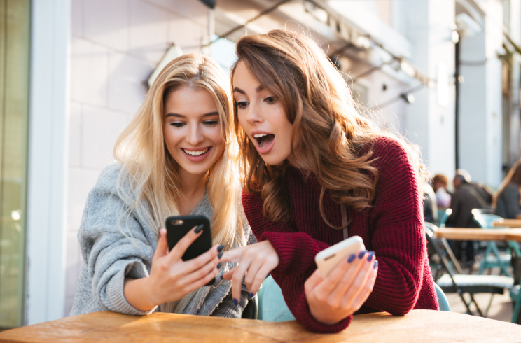 women looking at phone